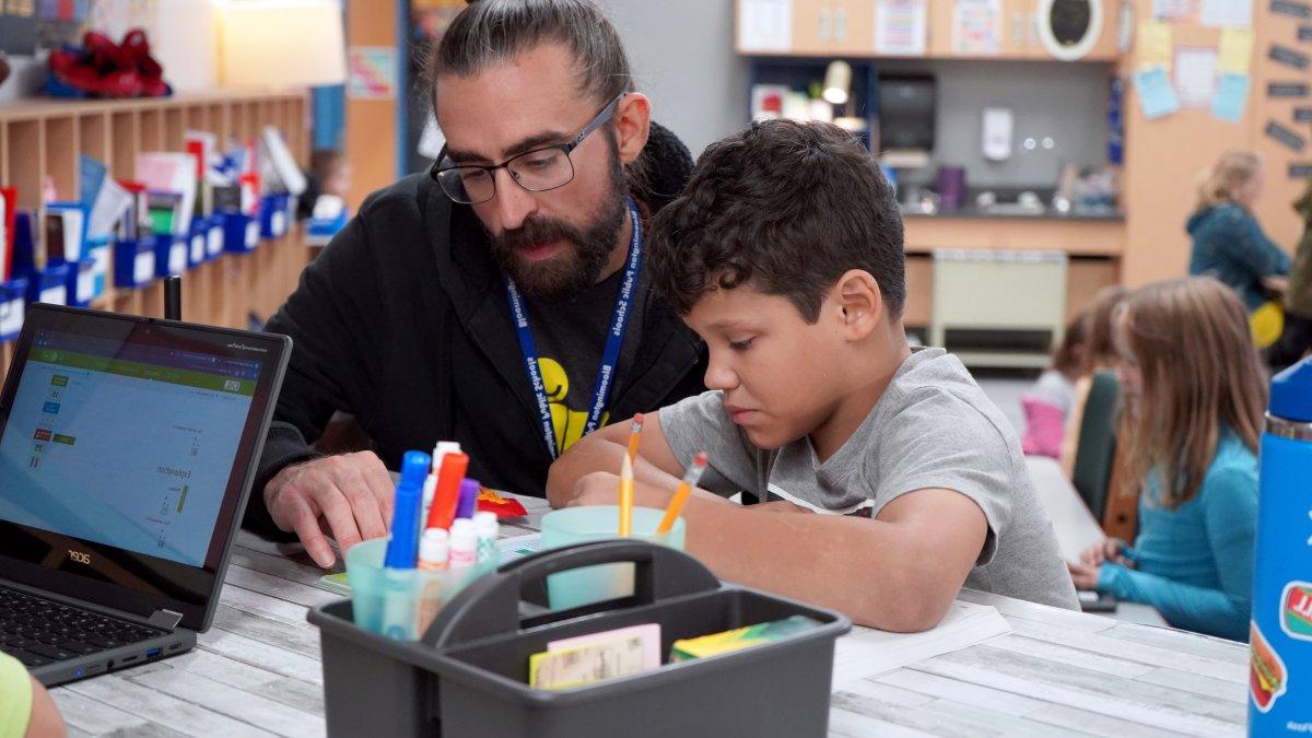 teacher working one on one with student